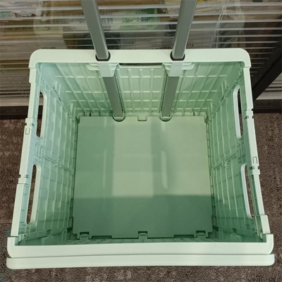 スーパーマーケットの座席ハンドルの車輪が付いているプラスチック買物車の折り畳み式のトロリー